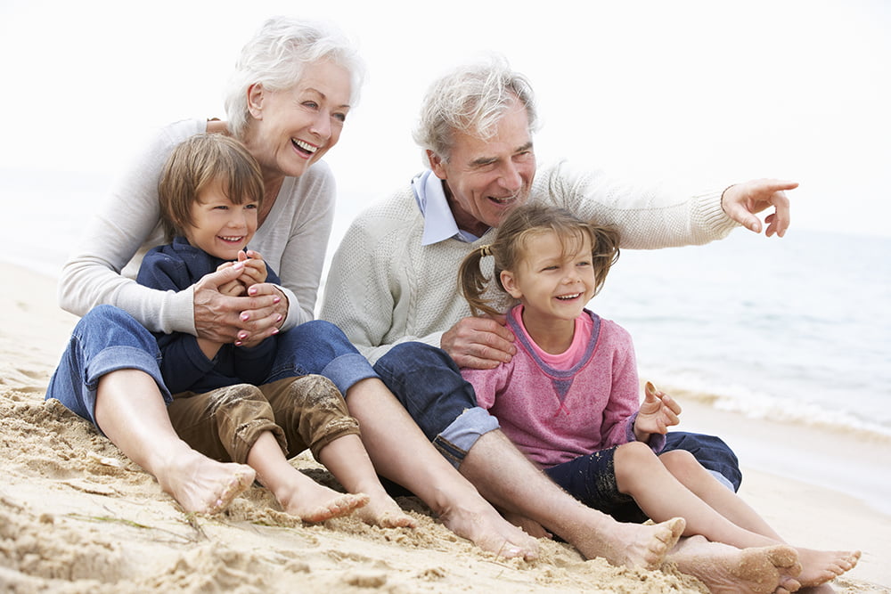 Grandparents With Children on a Beach - Mortgage Lender Gerard Buckely of Jaguar Mortgages for Wasaga Beach, Collingwood, & Thornbury.
